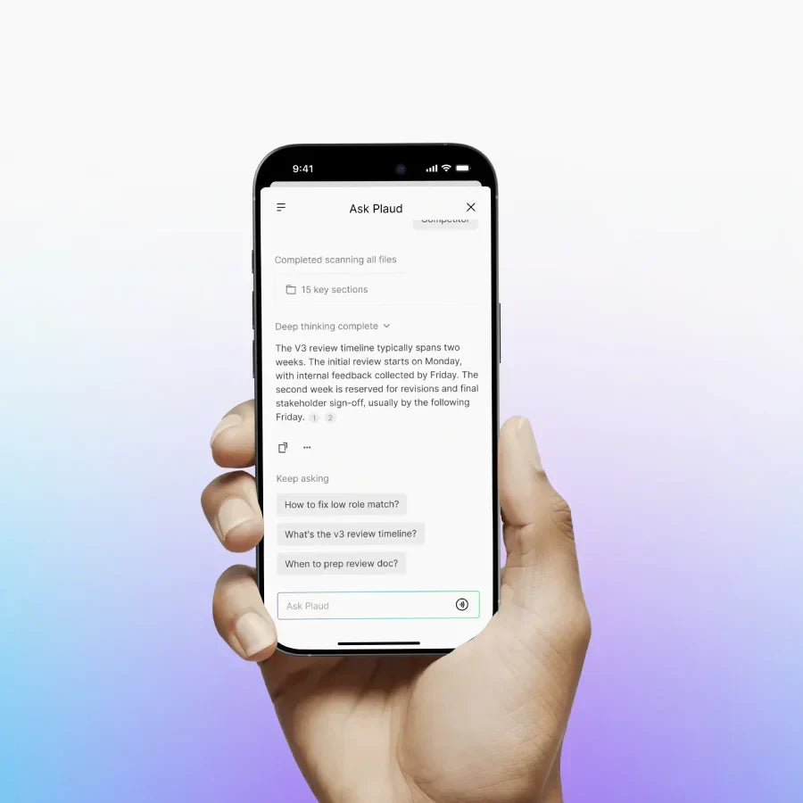 Hand holding a smartphone displaying the Ask Plaud feature in the Plaud App with a summary and follow-up questions.