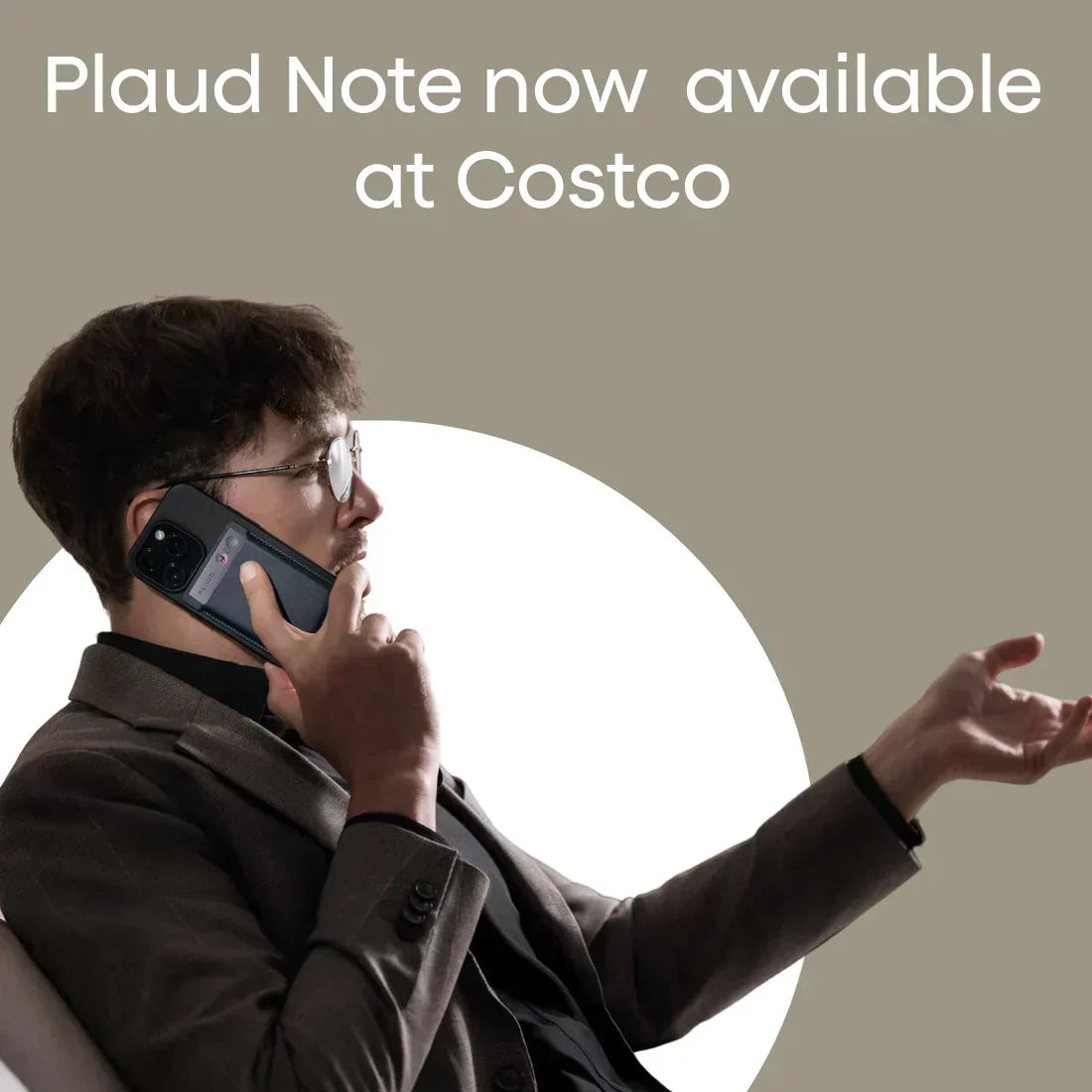 Plaud Note now available at Costco. Man holds a phone with a black Plaud Note attached to the back.