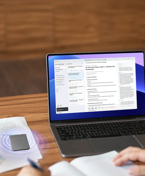 A gray Plaud Note Pro on a desk syncing lecture notes to the Plaud Web interface on a laptop.